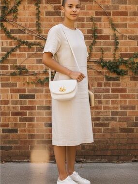 Emma Fox Cream Crossbody Saddle Bag with Gold-Tone Emblem